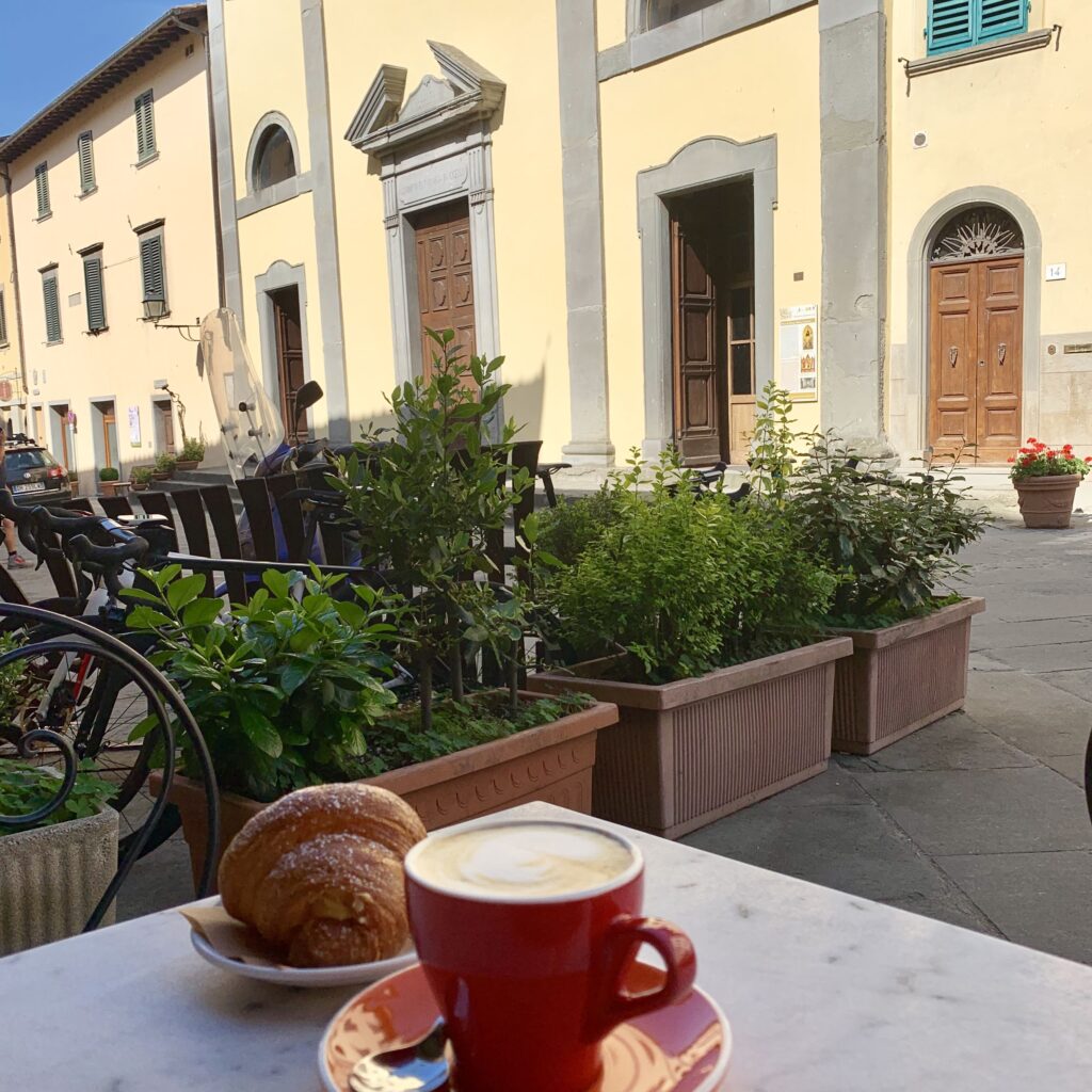 Italy travel. A cappuccino and cornetti for breakfast at the cafe in the main piazza of Stia, Italy. Brenda Ajay, Allegro Luxury Vacations, Italy travel expert