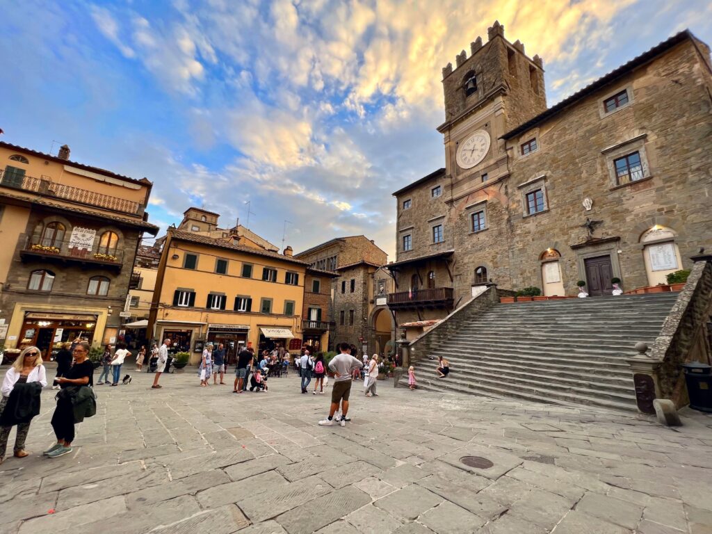 Italy travel. Piazza delle Repubblica in Cortona is a popular meeting place for locals and tourists alike. Brenda Ajay, Allegro Luxury Vacations, Italy travel expert