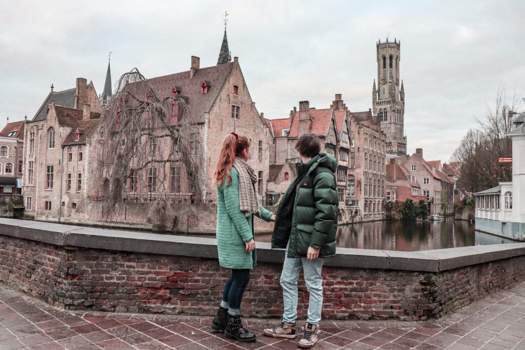 A couple enjoys a romantic getaway in Bruge, Belgium. Allegro Luxury Vacations. Honeymoons. Brenda Ajay, Virtuoso luxury travel advisor.