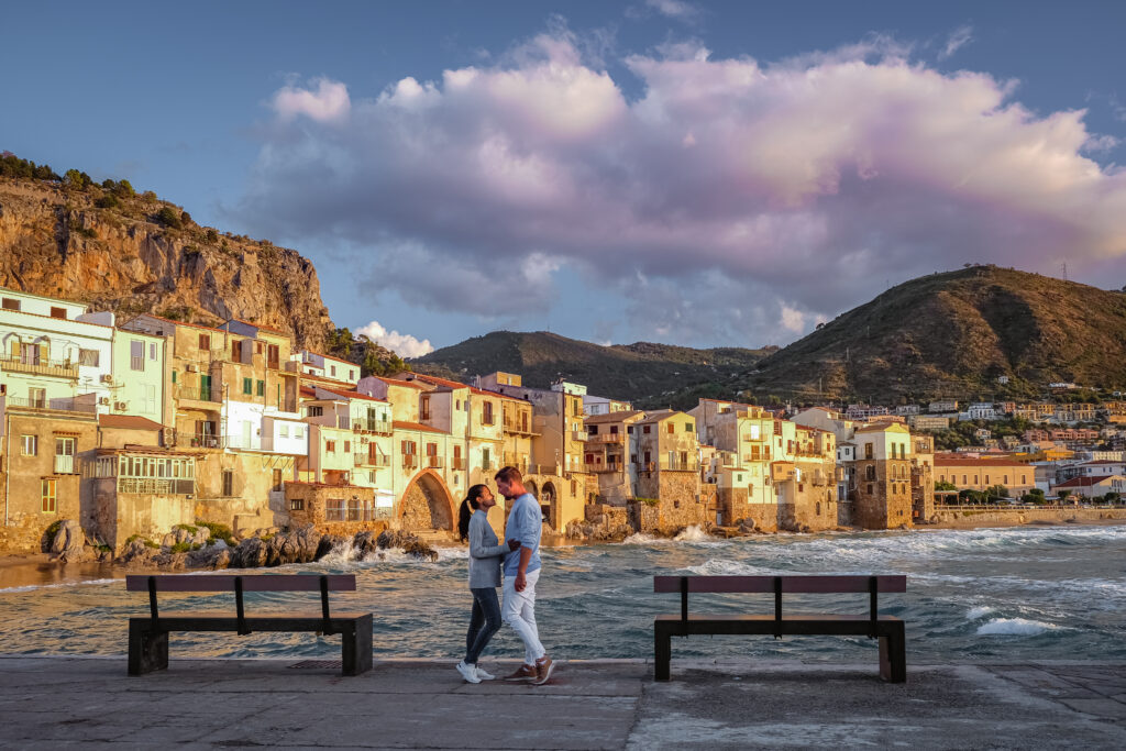 Cefalu, the medieval village of Sicily island, Province of Palermo, Italy. Europe, a couple on vacation at the Italian Island Sicilia. Romantic getaway. Allegro Luxury Vacations. Brenda Ajay, Virtuoso Travel advisor